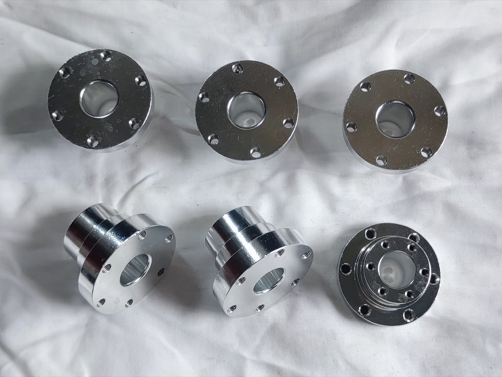 CNC machined flanges plates and round housing components